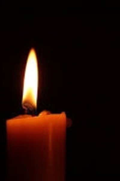 by the flicker of a candle